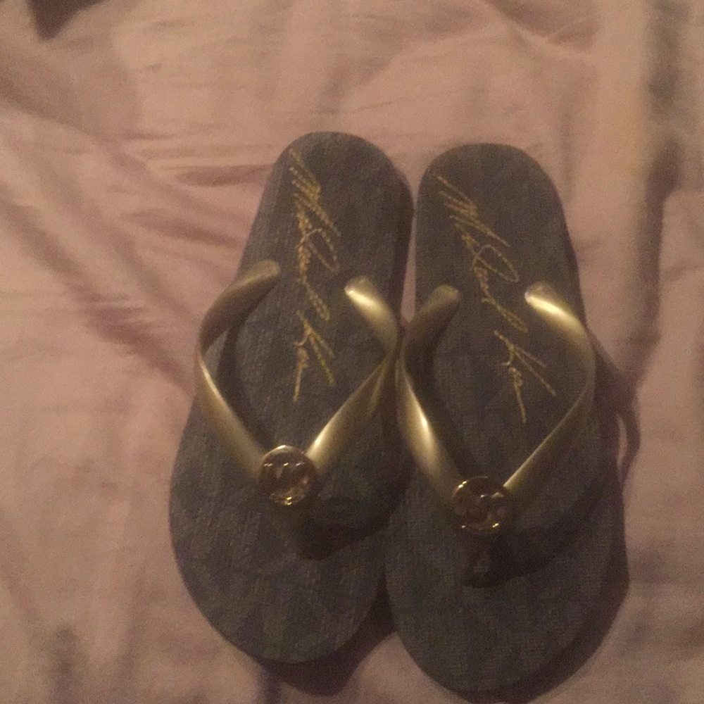 Nearly new Michael Kors flip flops. Gold